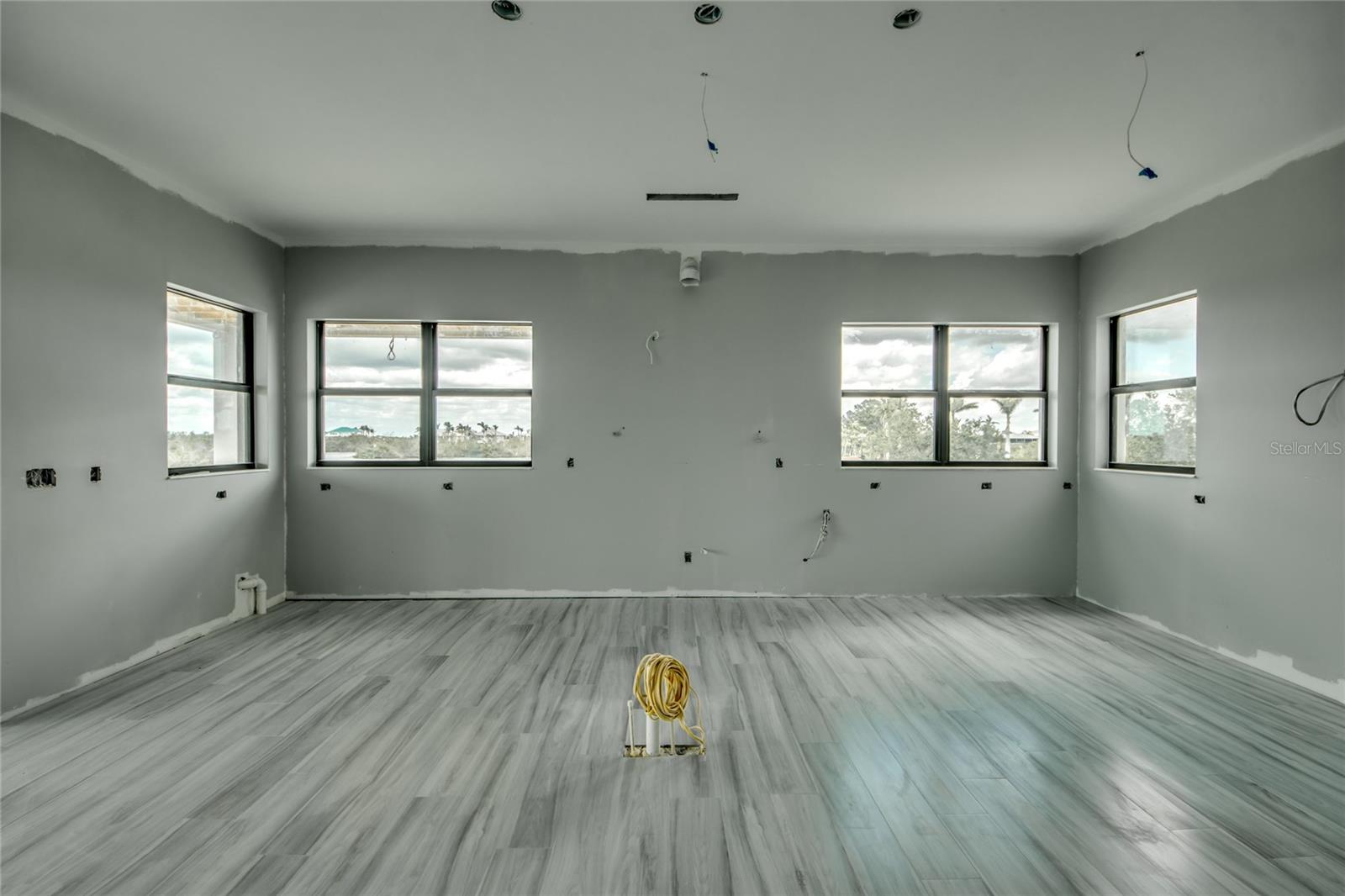 Kitchen prior to cabinet install - HUGE kitchen island with quartz countertops and tons of room to gather around!