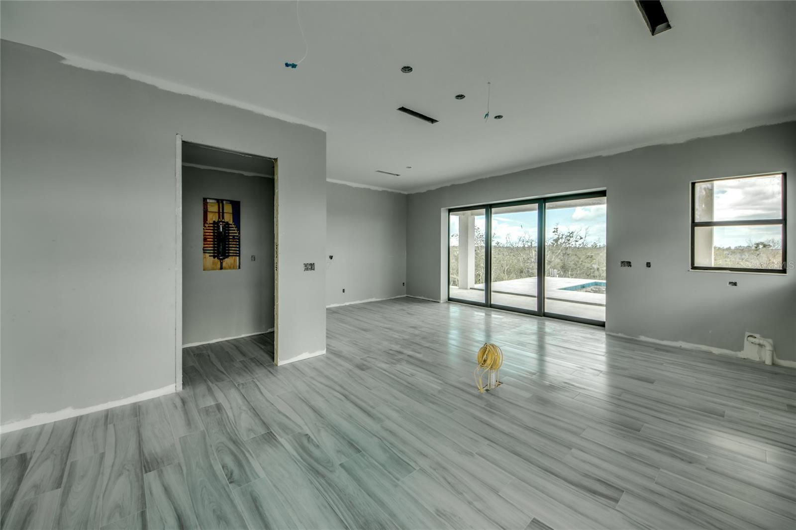Another view of the kitchen, dining, pantry and outdoor area!