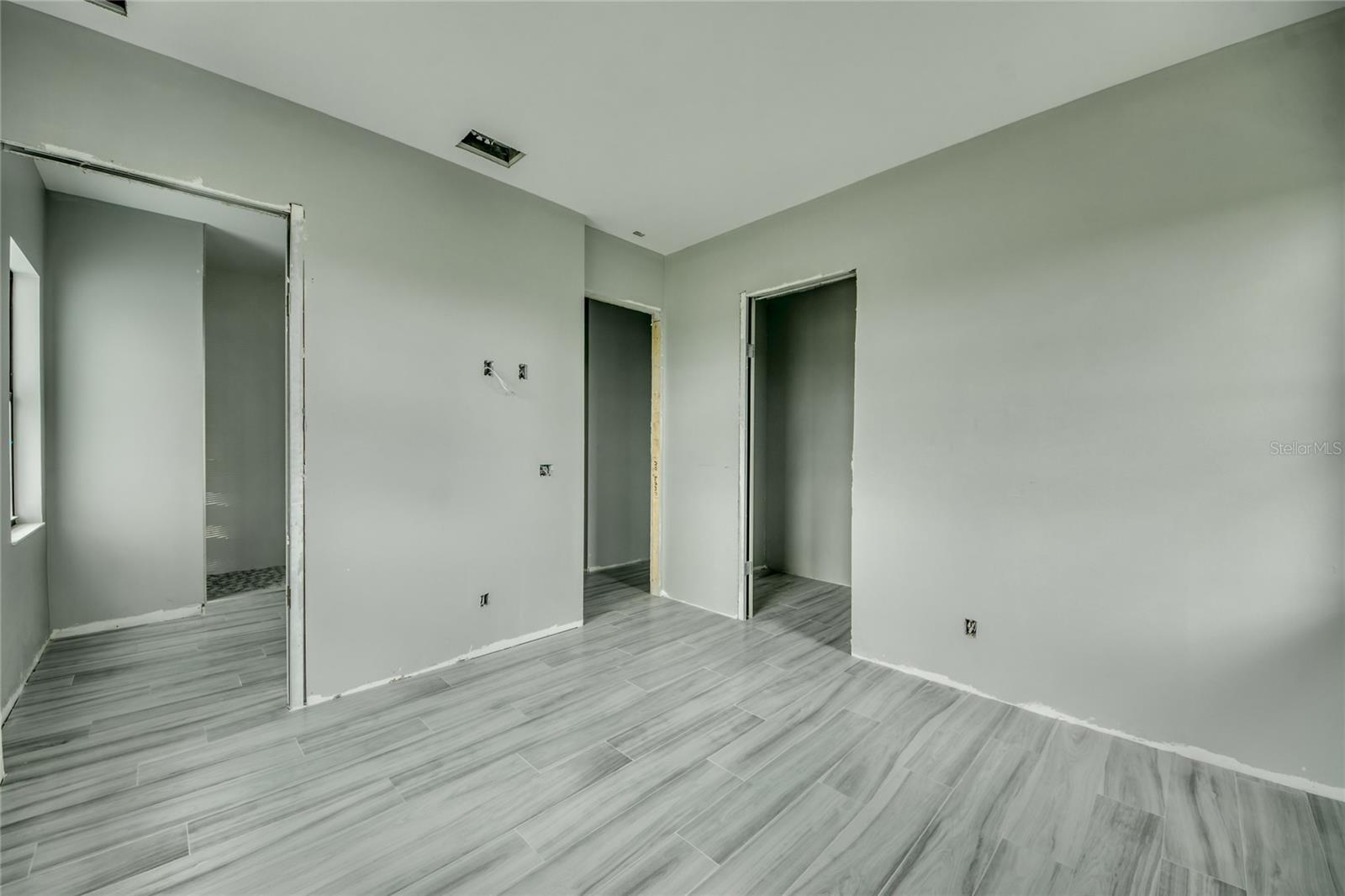 Guest suite with attached bathroom and walk in closet.  Also located in its own wing, it offers privacy and spaciousness!