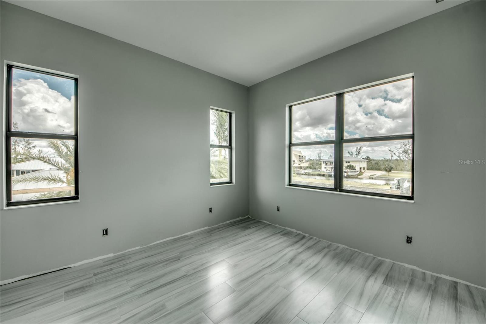 Guest suite located in its own wing (corner of the home).  Lots of natural light again, walk in closet and the same ceramic tile as the rest of the rooms on the main living area.
