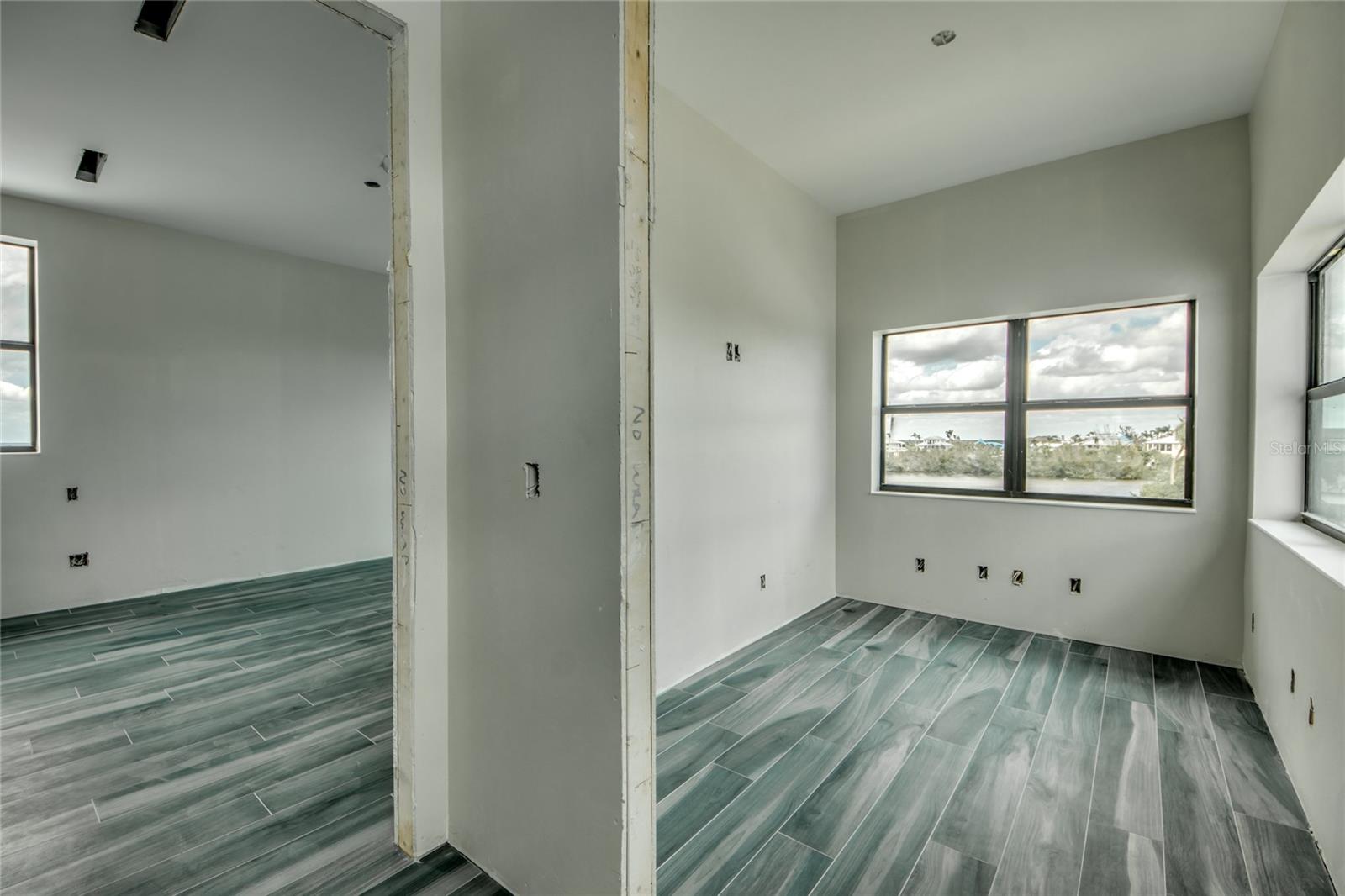 Master suit is the entire upstairs.  In addition to the bedroom, large walk in closet and bathroom, there is an office space with incredible views.  The office will have custom built in cabinetry.