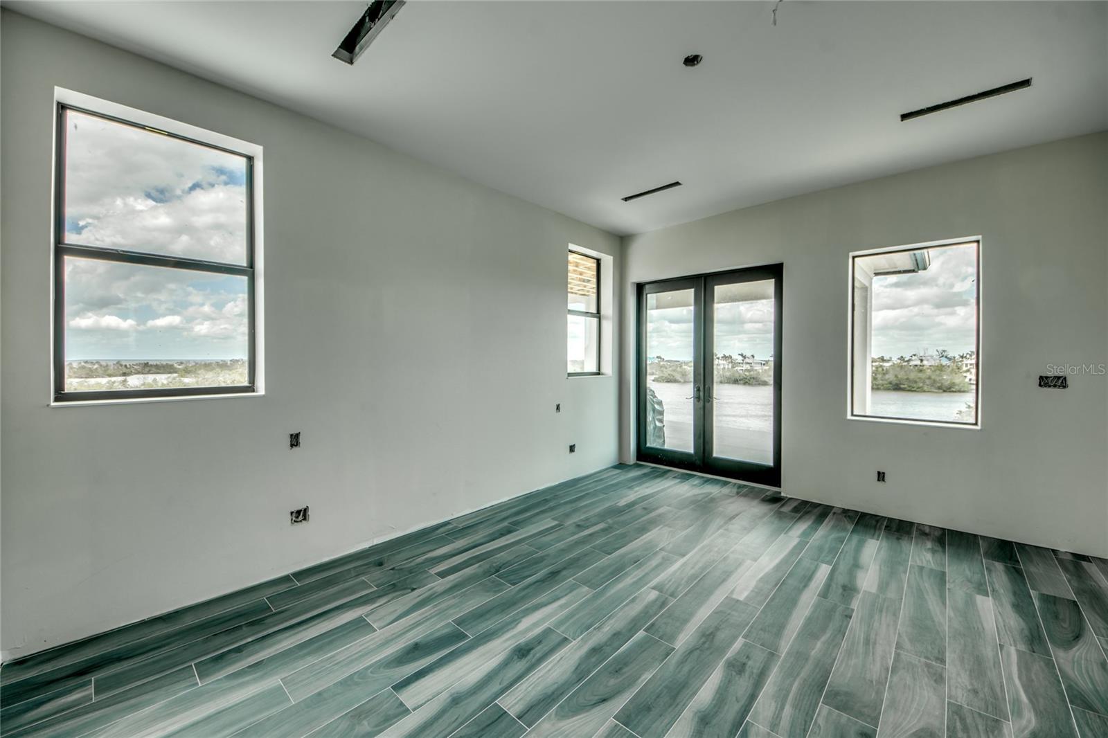 Master bedroom suite is second to none!  Large outdoor patio that is both screened in and has additional hurricane rolldown shading.  Perfect for several hammocks, outdoor lounging area!  Best views in the house - Cayo Costa and Boca Grande are easy to view!