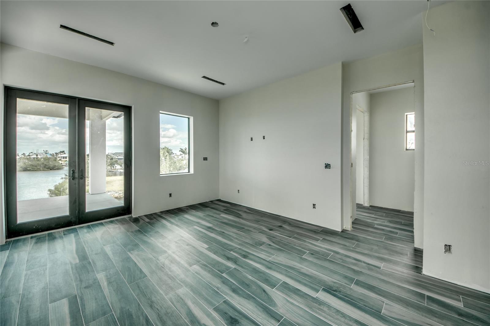 Master bedroom suite with walk in closet, spa like bathroom and office!  Added BONUS is the outdoor living area that is such a big part of each story of the home!