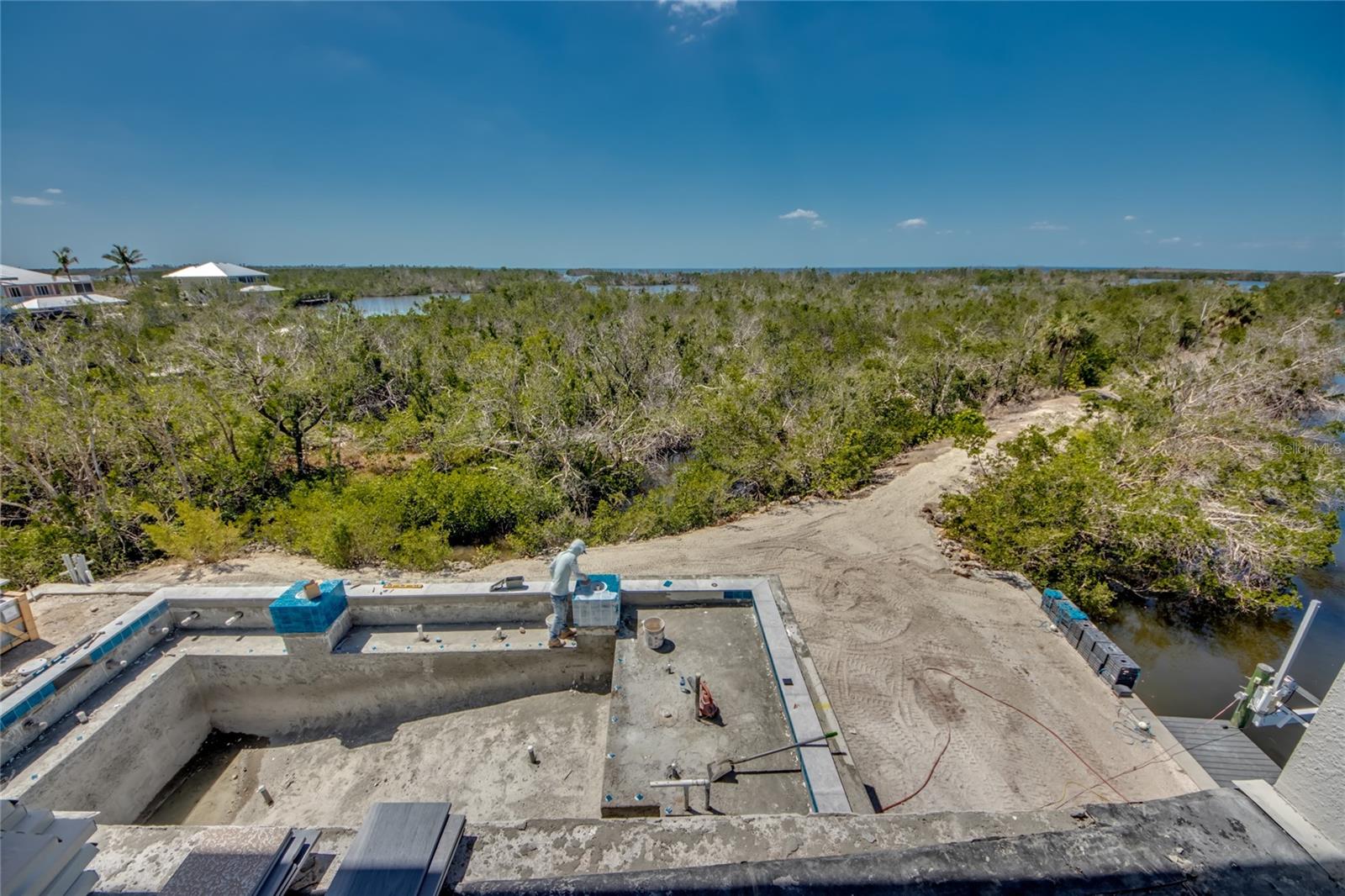 Looking down from the master suite to the resort pool and the mangroves and out to the waters of Charlotte Harbor and the Gulf of Mexico - every day is a different sunrise, a different sunset - a treasure of a home and location!
