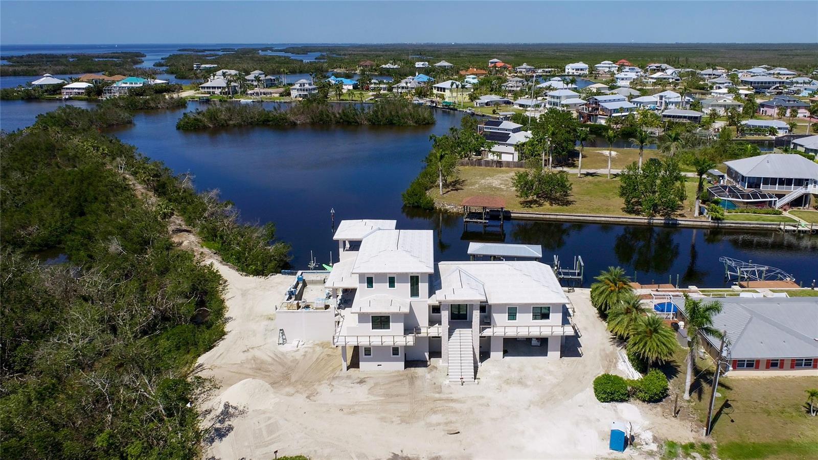 Aerial view of "Pirate Paradise" - a one of a kind custom designed home built with maximizing both the indoor and outdoor living that is so vibrant and is right there in your back yard!
