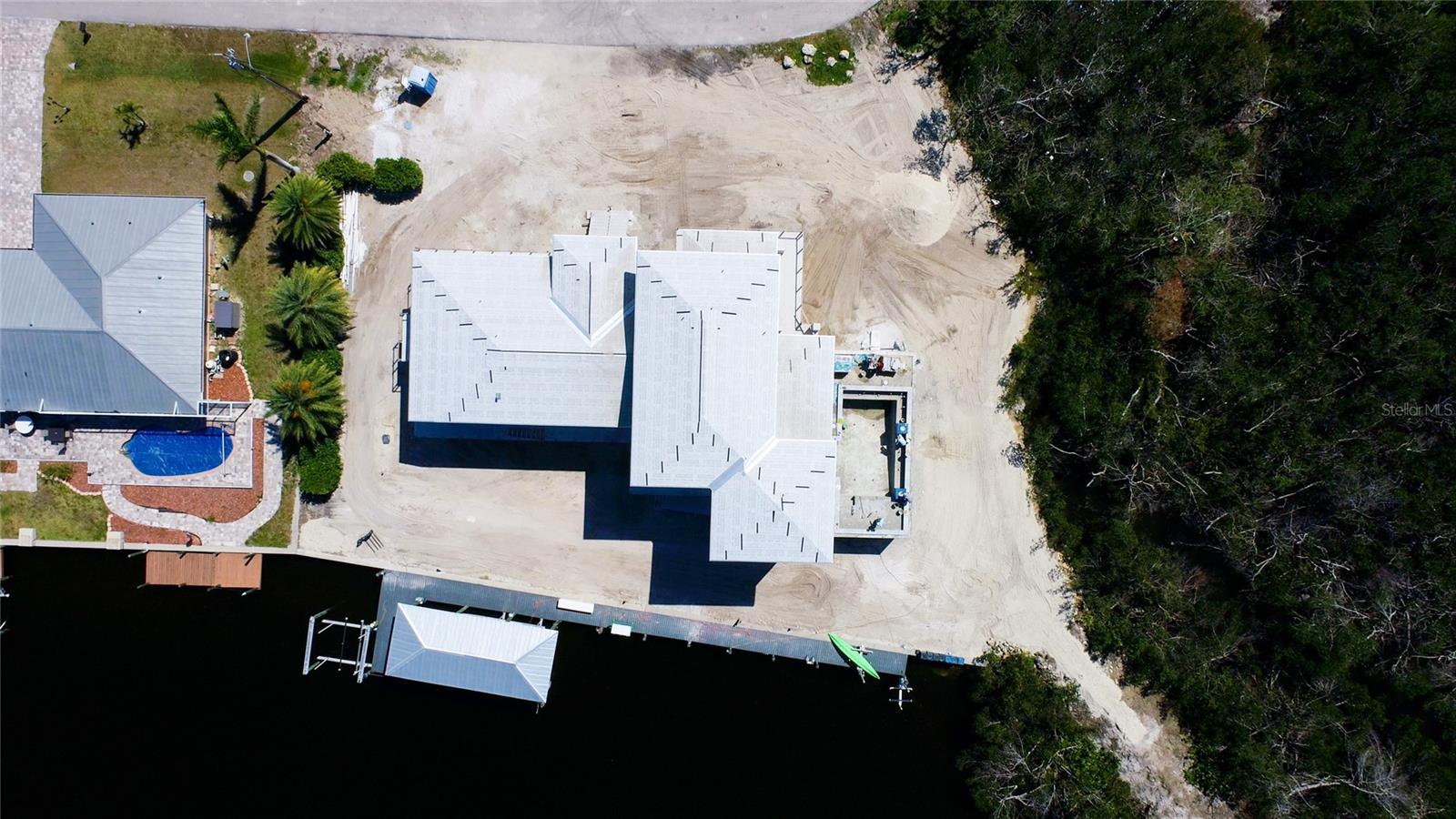 Located on a double lot with mangroves to the west - a rare lot to find so close to the water!
