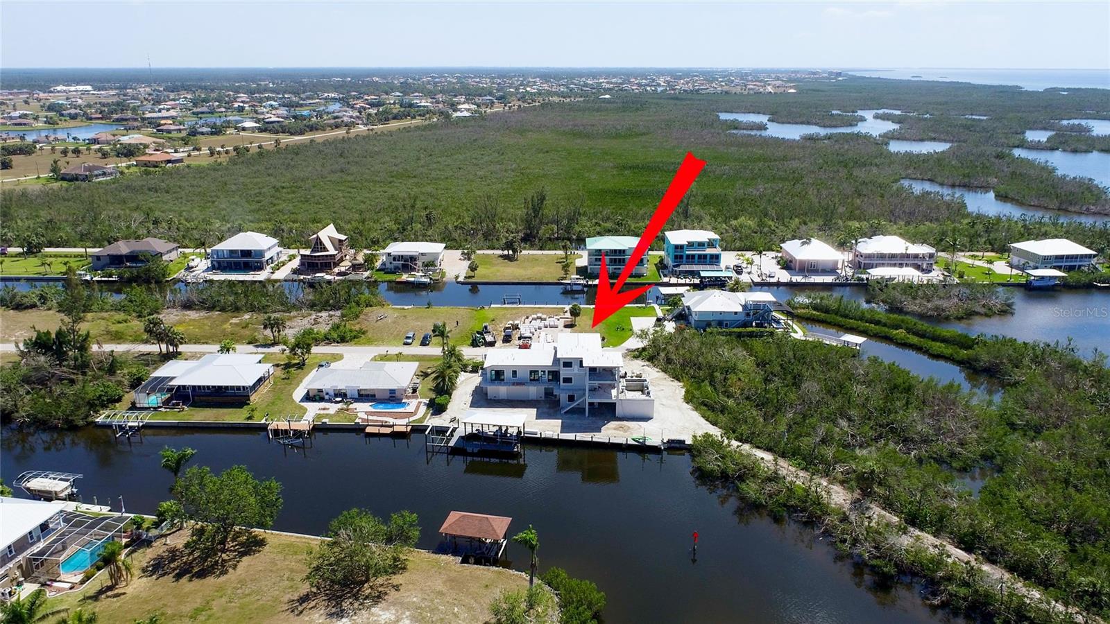 Looking south to the Burnt Store Marina area - less than 10 minutes by boat to the largest Marina between Tampa and Miami - sailing club, golfing, pickleball, tennis and a waterfront restaurant.  Dry and open boat storage options depending on availibility.