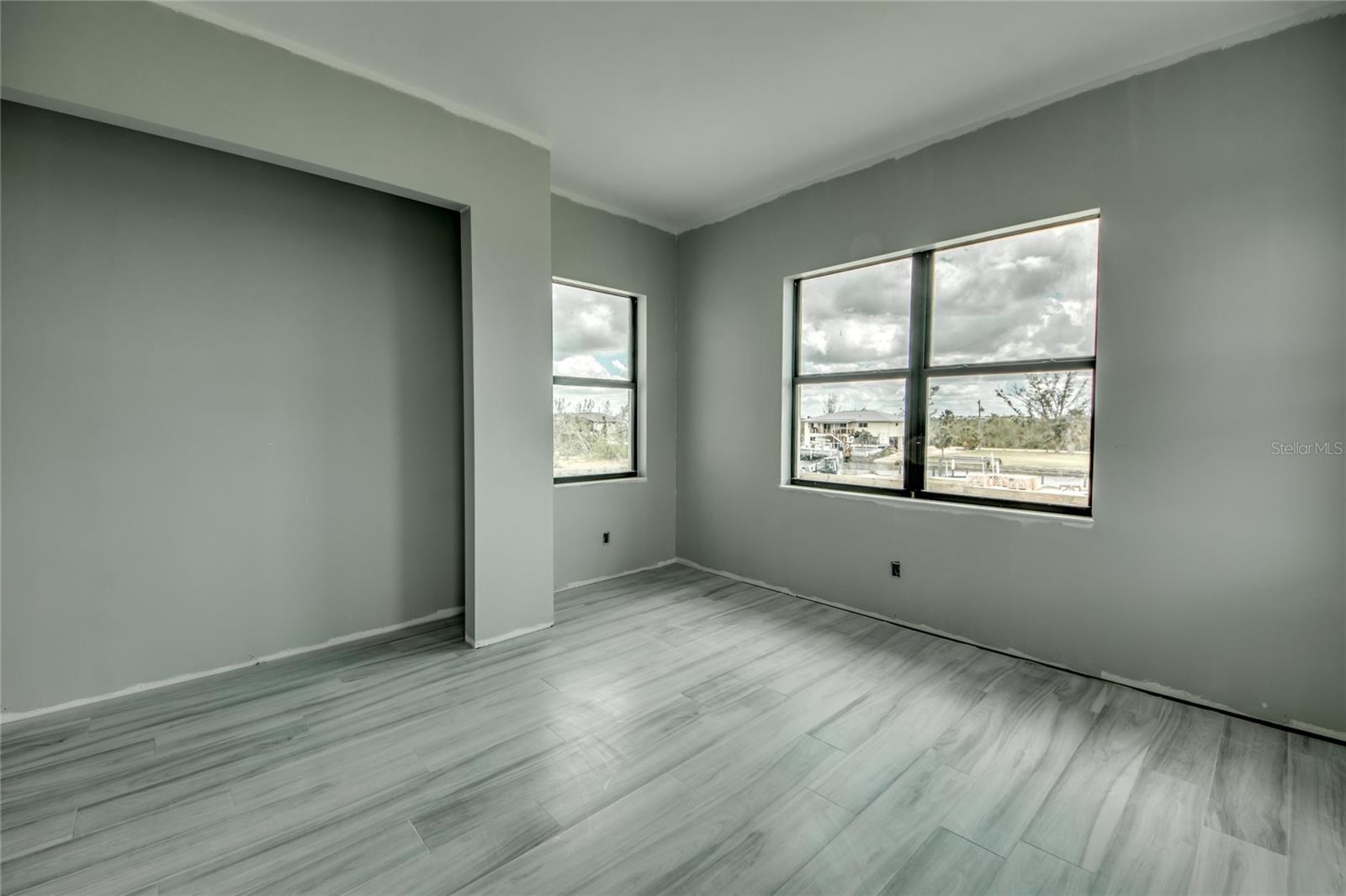 Second floor guest suite - this overlooks the front of the home and is located in its own wing with private bathroom.  One of three guest suites on this level.