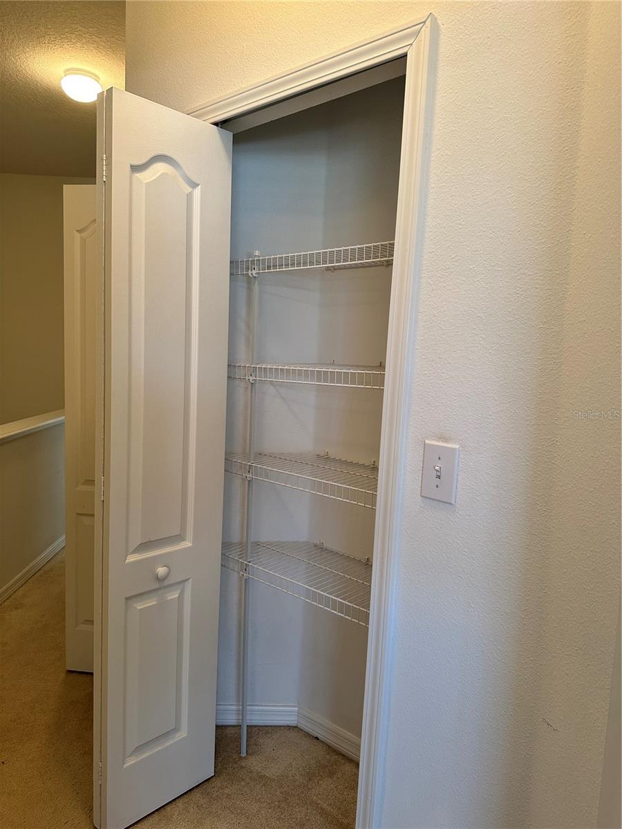 Linen Closet (Between Primary Bedroom &amp; Laundry Closet)