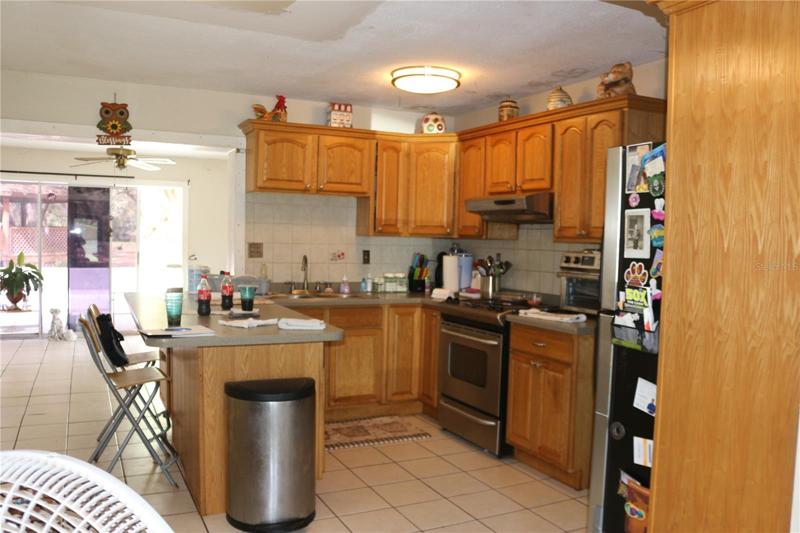 Kitchen with wood cabinets