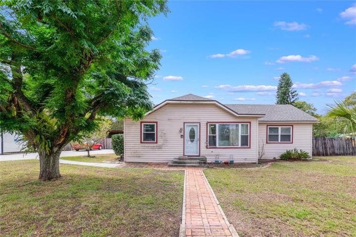 Winter Park charmer with short term/rental possibilities, a brand NEW ROOF (2023), NEW KITCHEN (2022), UPDATED A/C (2022), WATER HEATER (2023), WOOD LOOK TILE throughout and a FINISHED SHED (drywall, window a/c and electric!) on 3 LOTS for .49 ACRES!