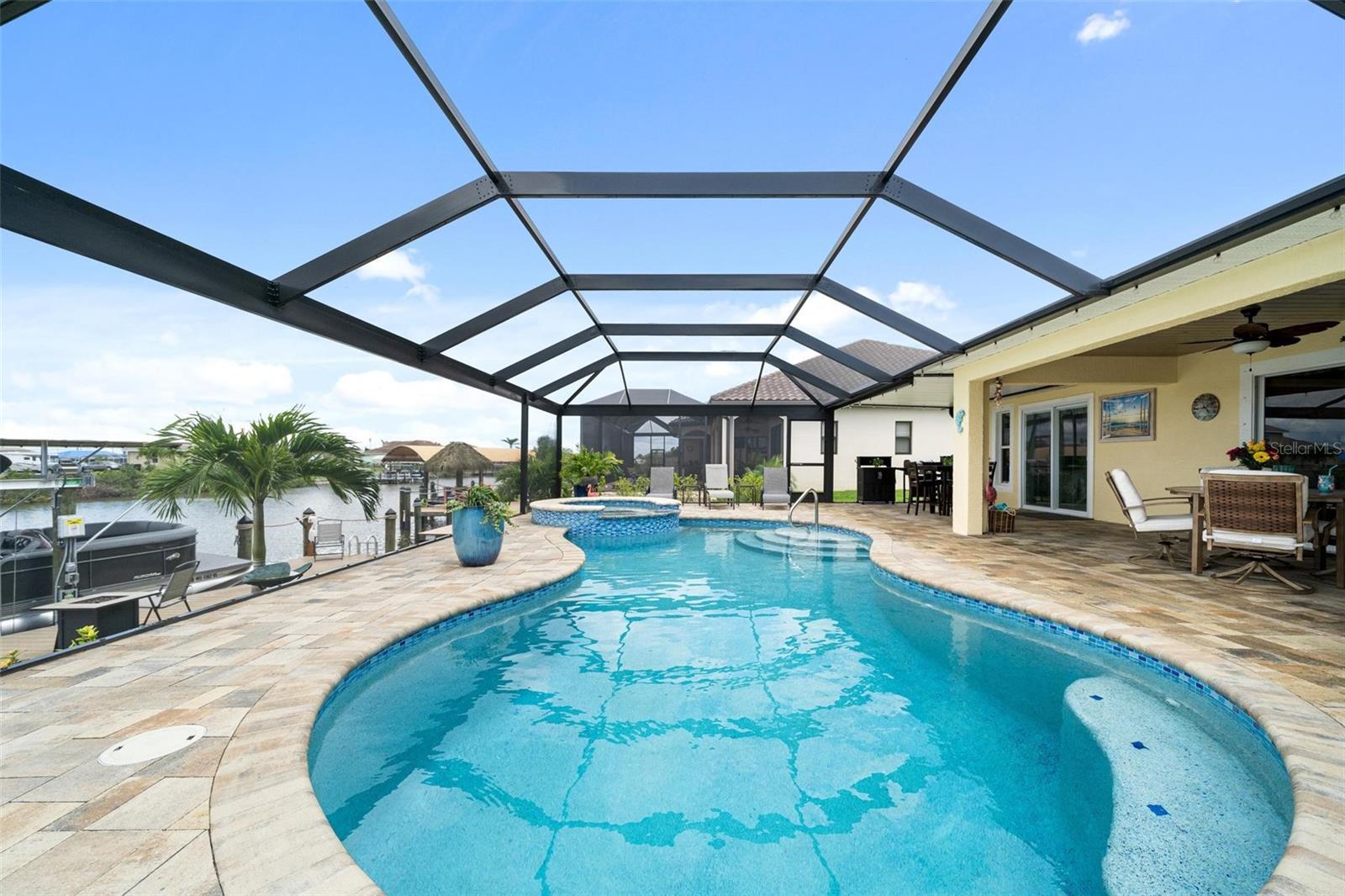 Pool, spa and tanning area looking East