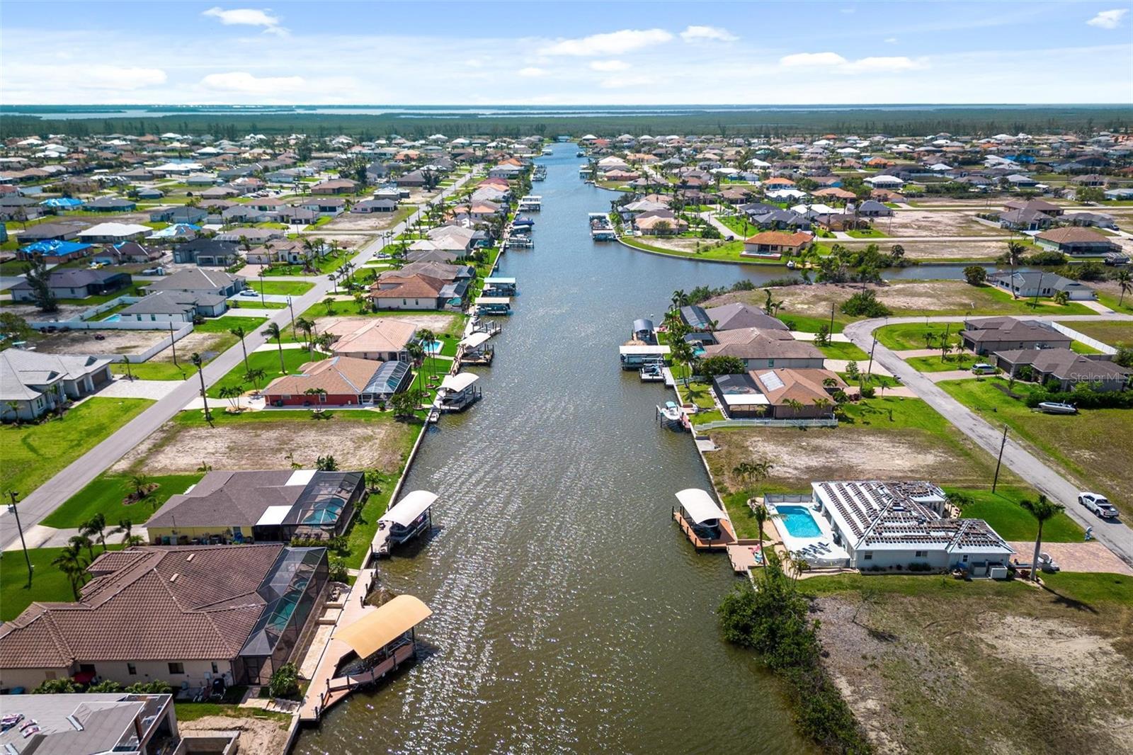 Aerial View - Looking west down the Bonefish Canal to the NW Spreader. One bridge to open water. Matlacha/Pine Island in the background
