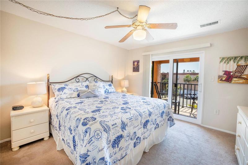 The bedroom has a large walk in closet and a balcony.