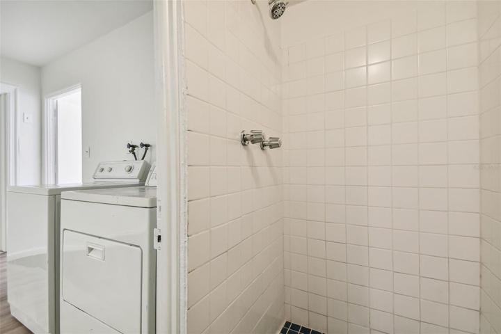 Full bathroom with shower in garage