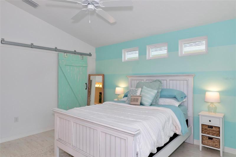 Barn door leading to walk-in closet
