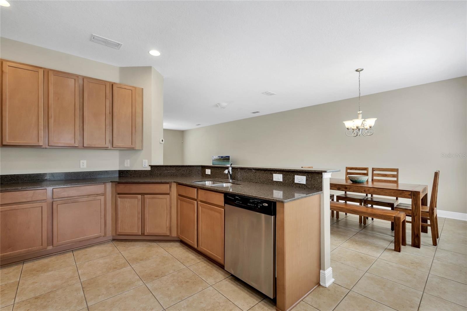 Spacious kitchen, 42" cabinets and stainless steel appliances,  open to the great room and dining room with breakfast bar.