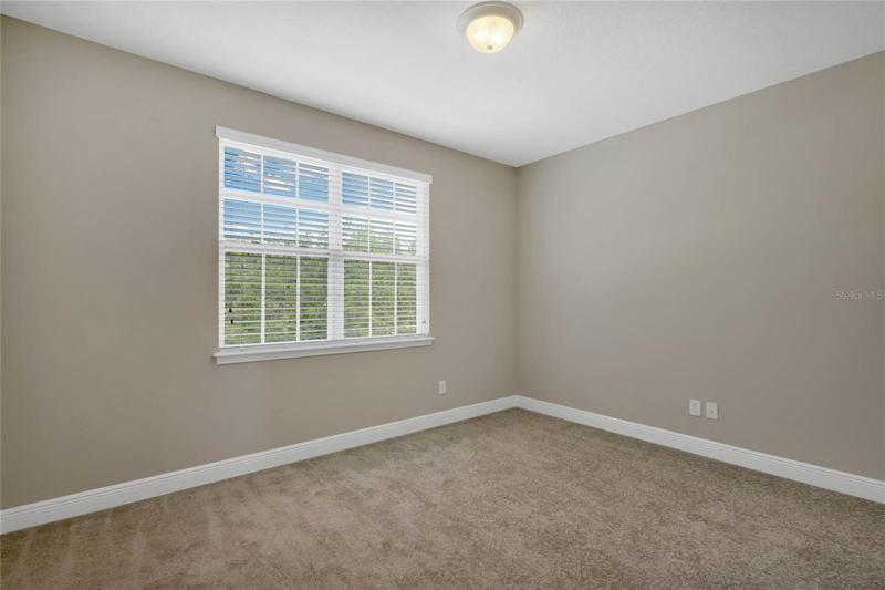 Bedroom 2 is light and bright.