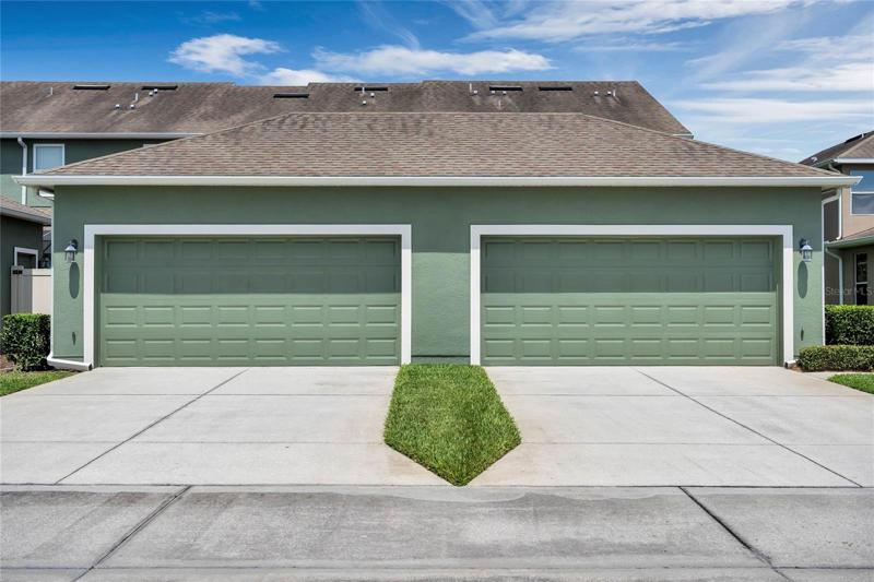 Large two car garage with plenty of driveway space.