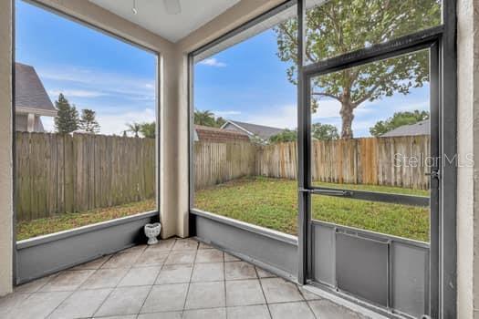 SCREEN-ENCLOSED PORCH IN REAR OF HOME