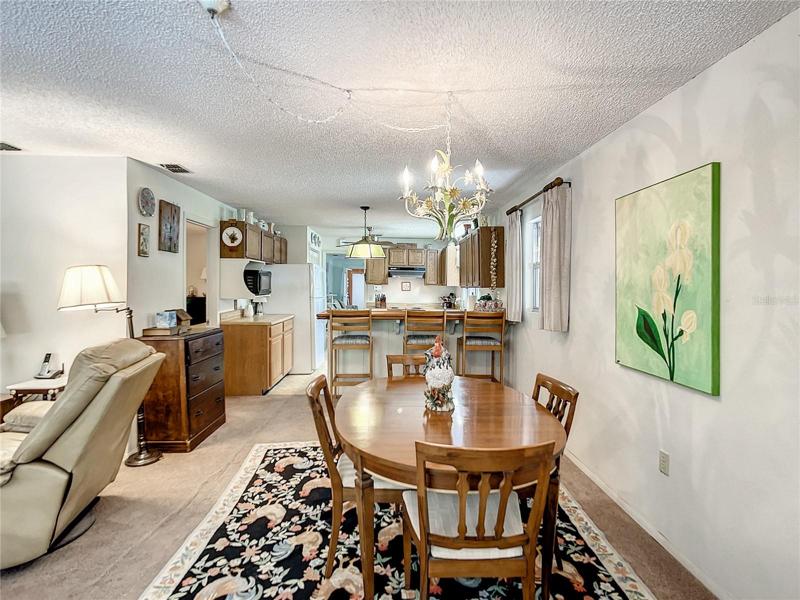 Family room is to the right and the kitchen is at the back of the picture.  The door to the left opens to the master bedroom.