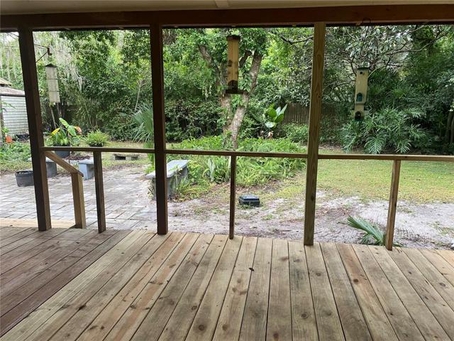 Porch with view of the back yard.