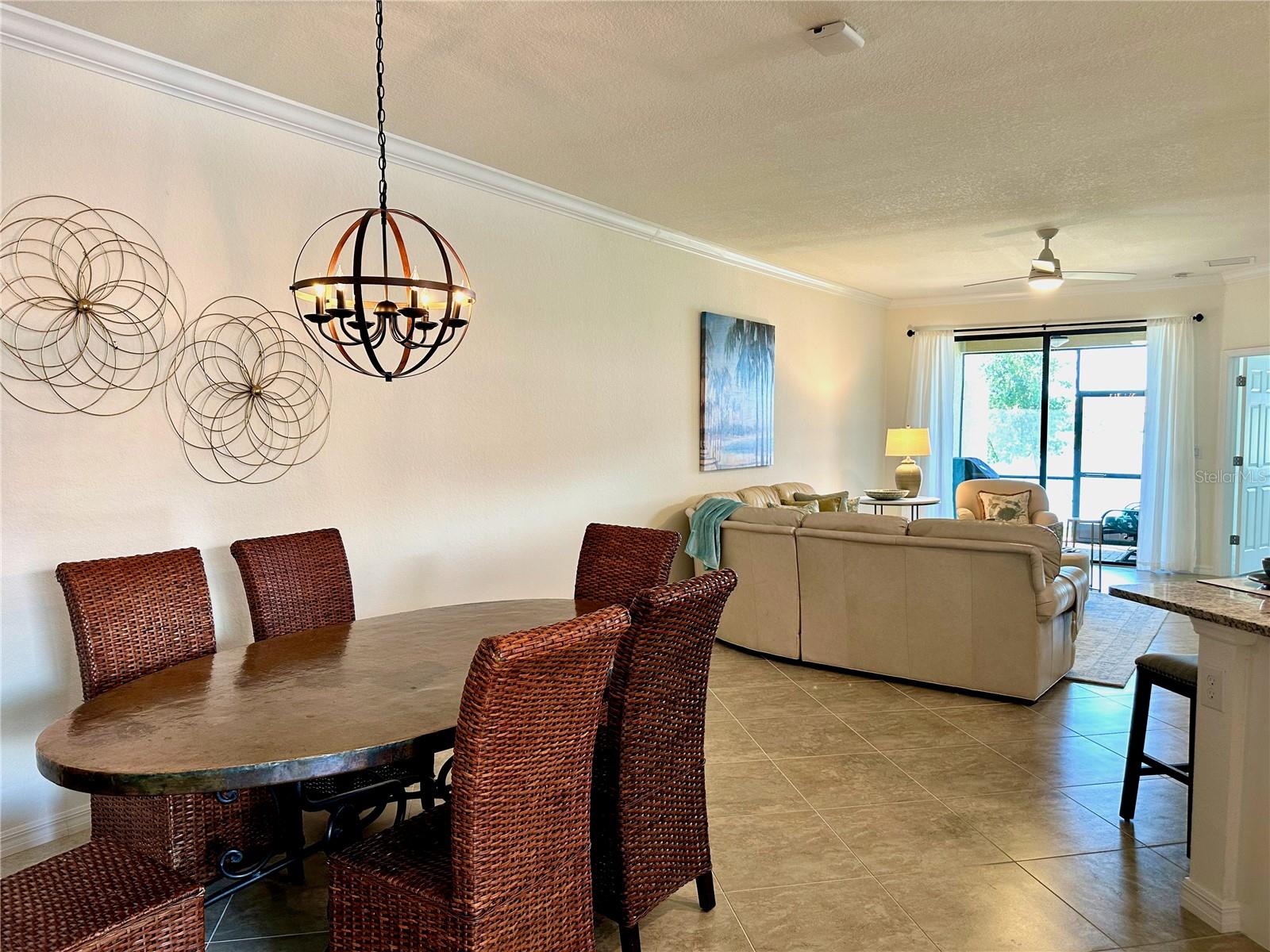 Standing in the entry and looking down to the living area and onto the lake