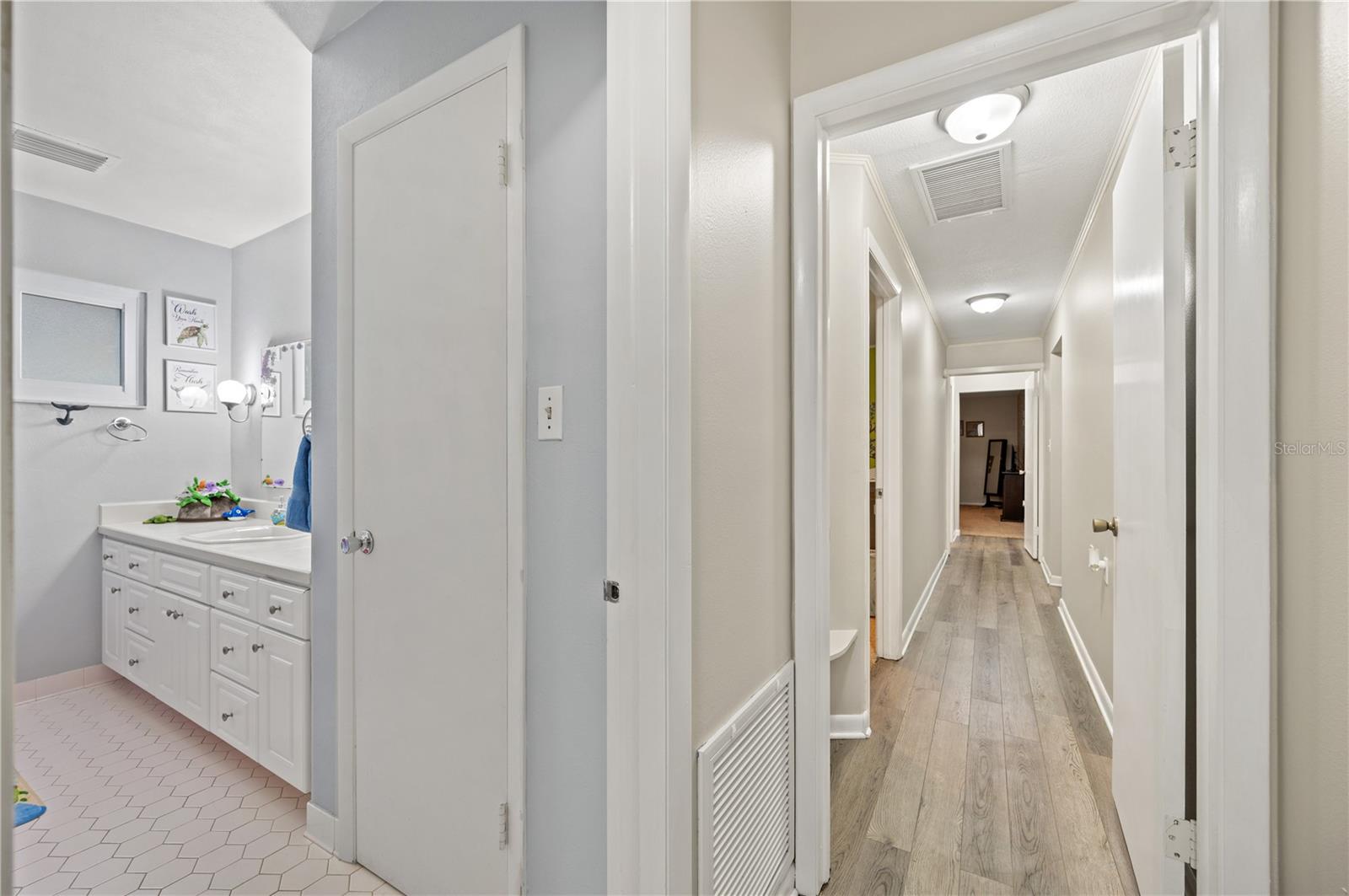 hallway with bedrooms and bathrooms