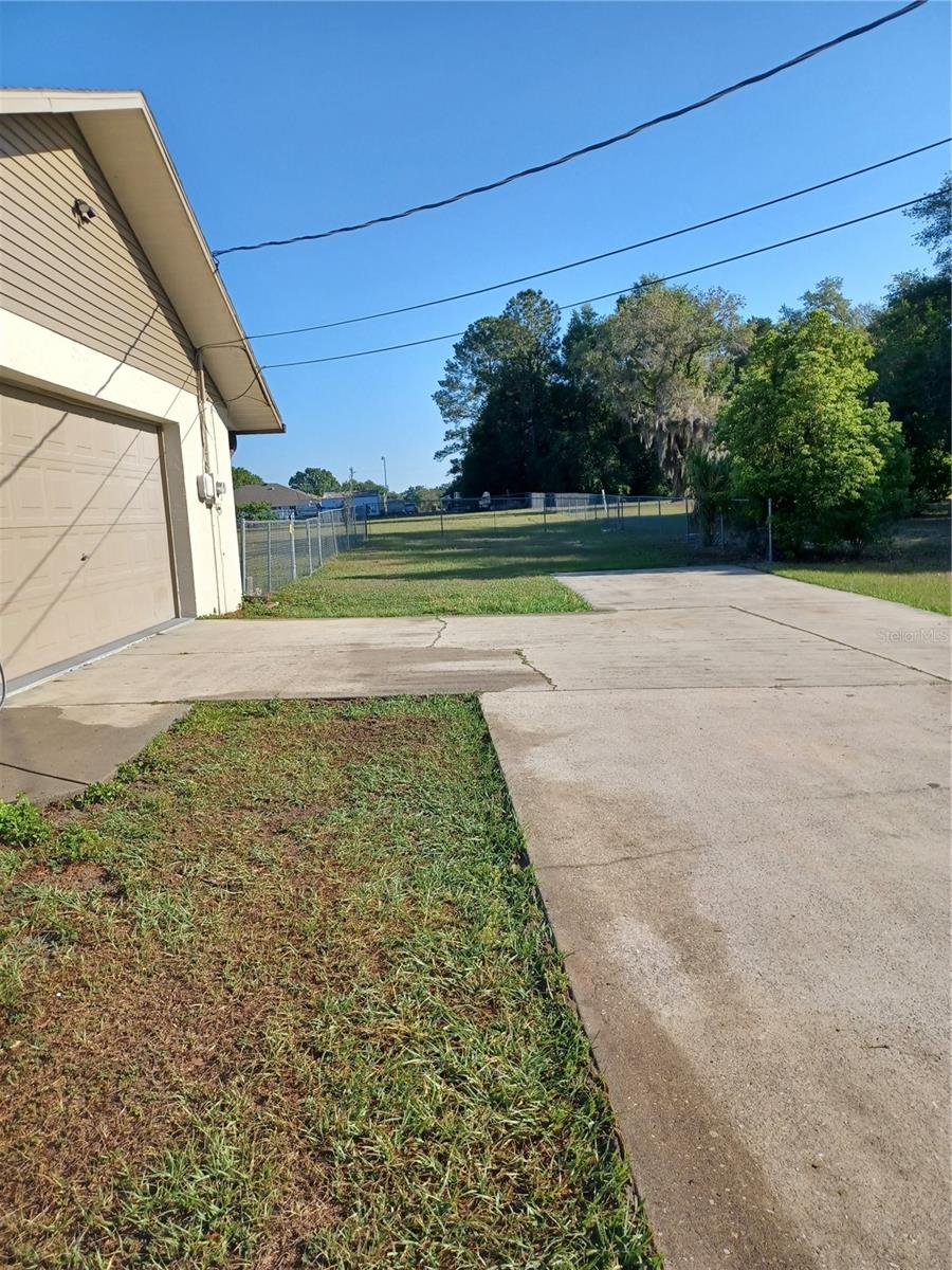 Side of garage and long driveway