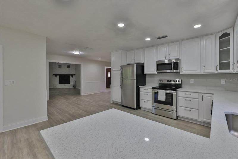 Kitchen with view into Living Room