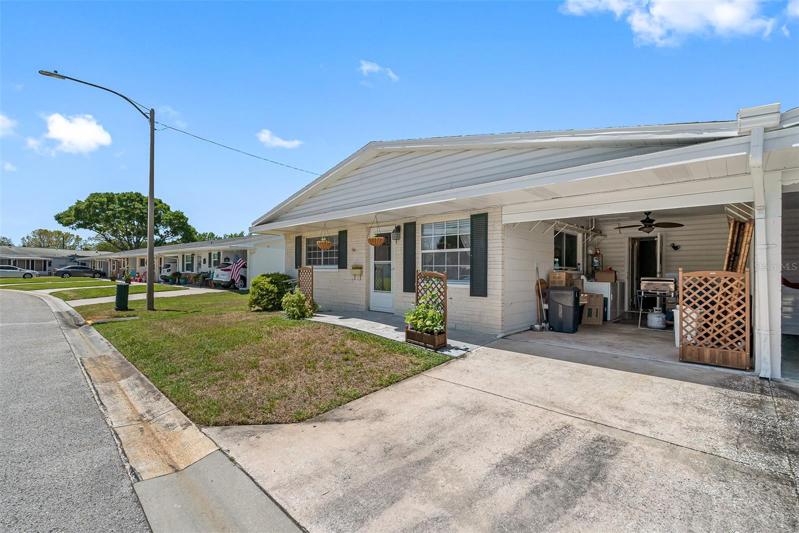 Front of villa, show driveway next to front door