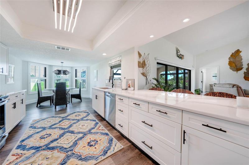 wide kitchen design makes for ample counter space, plenty of drawers and room to entertain