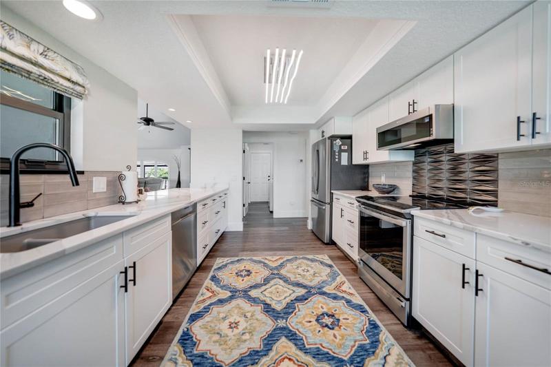 gorgeous lighting, upgraded hardware and fixtures give this space an upscale look
