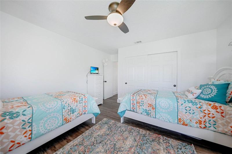this guest room shares a hallway with the other guest room and a bathroom