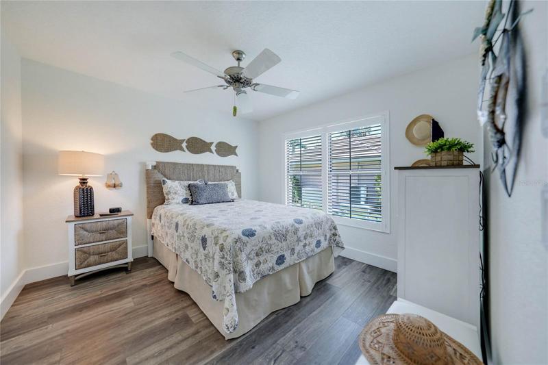 large closet to the left and room for nightstands and a dresser make this room very welcoming for guests