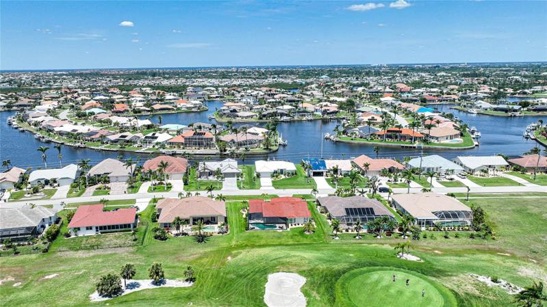 Rear view of the property.  Burnt Store Isles is a golfing and boating community with a nice assortment of homes on canals and the private golf course.  You can join the private club as a golfer or as a social member if you wish, but it is not mandatory as part of living here.  