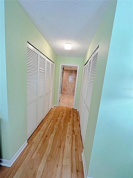 MASTER BEDDROOM PLENTY OF CLOSET SPACE LEADING TO BATHROOM ENSUITE