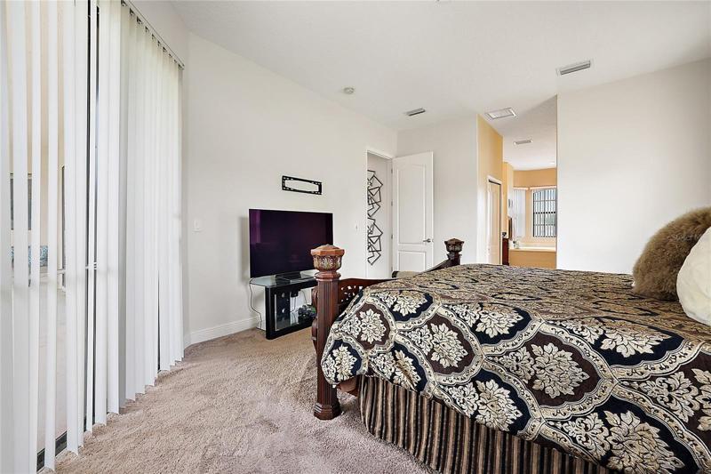 Master Bedroom with Sliding Doors leading to Back Patio