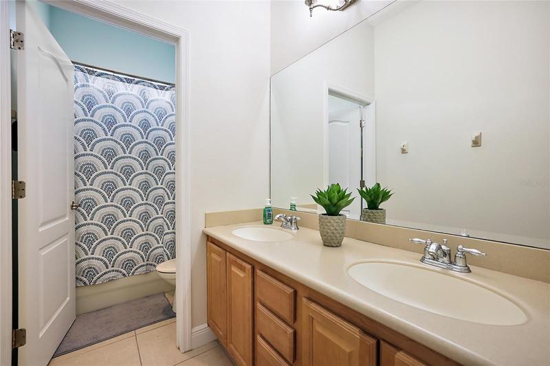 Bathroom Two with Dual Sinks and Tub/Shower Combo