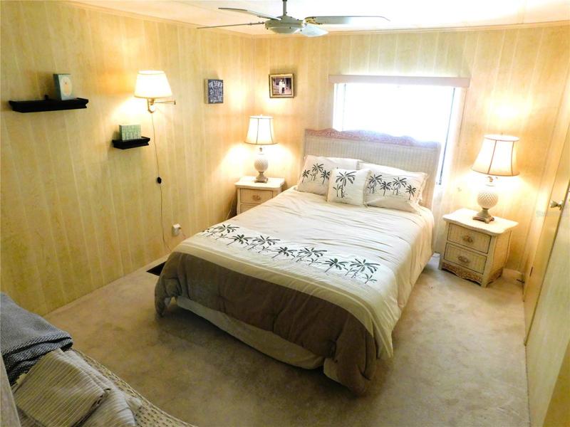 Bedroom #2 has ceiling fan, walk-in closet and carpeting.