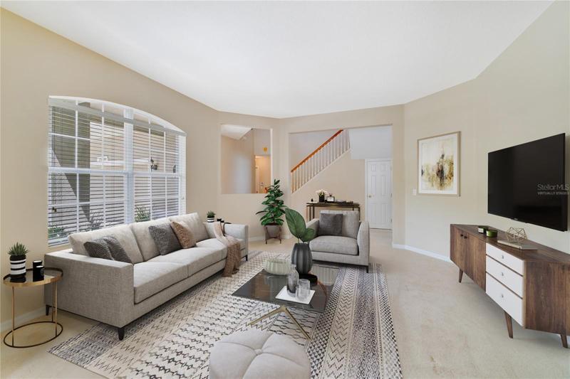 The foyer opens up for formal or flex spaces - entertain with ease in the light and bright space or use for whatever else your family might need! Virtually Staged.