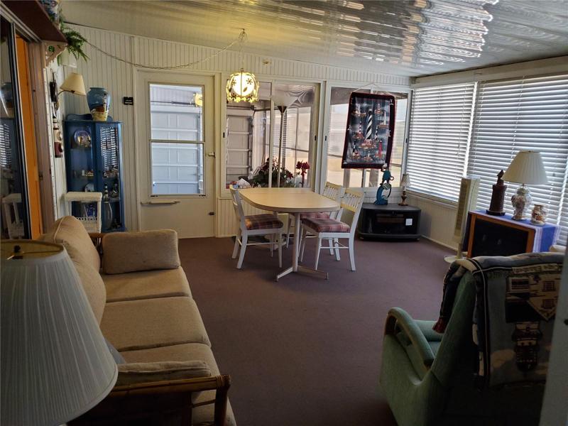 View of Lanai from the hall to Utility Room