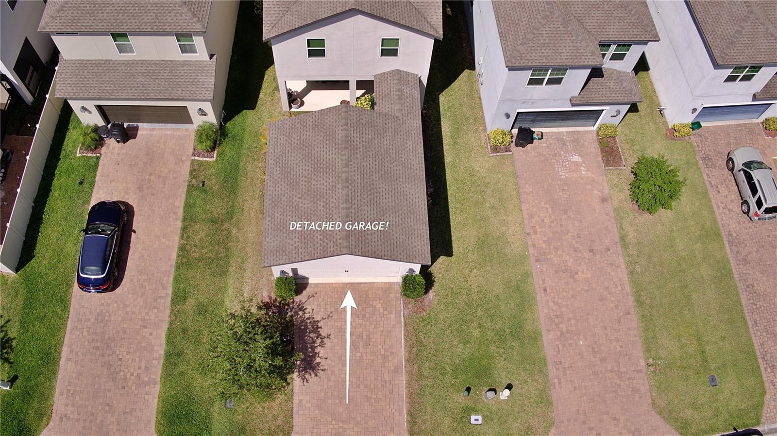 The detached garage creates an amazing courtyard  setup. Compare to other homes.