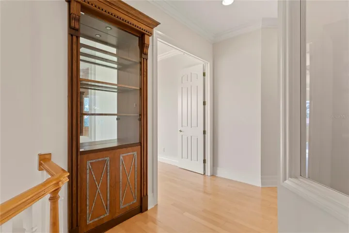 Hallway Built In before Owners Suite Entry