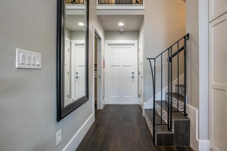 Hall to laundry, garage and stairs to bed 5 from kitchen