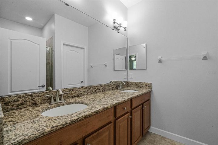 Master bath with dual sinks and shower.