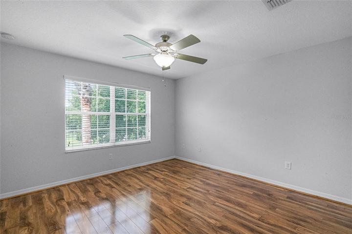 First floor master bedroom with ceiling fan and master bath en-suite.