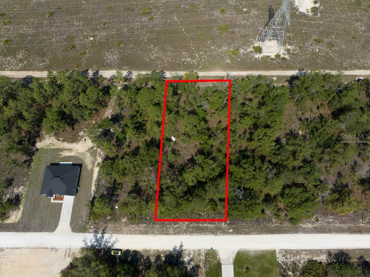 Virtually Staged.   Lines drawn on images are for informational purposes only.  Please hire a professional land surveyor to verify the property boundary.