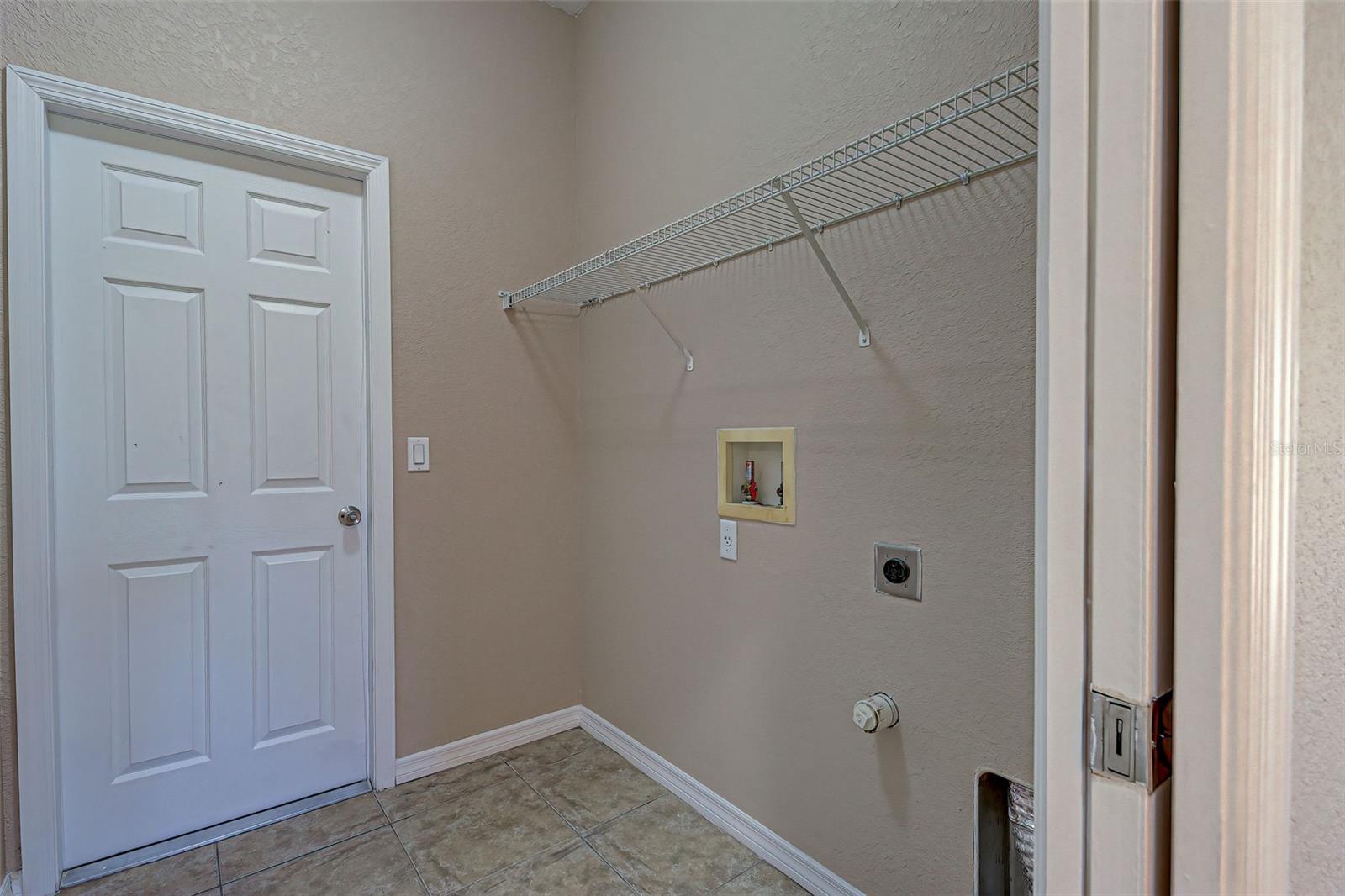 Laundry room with access to the garage