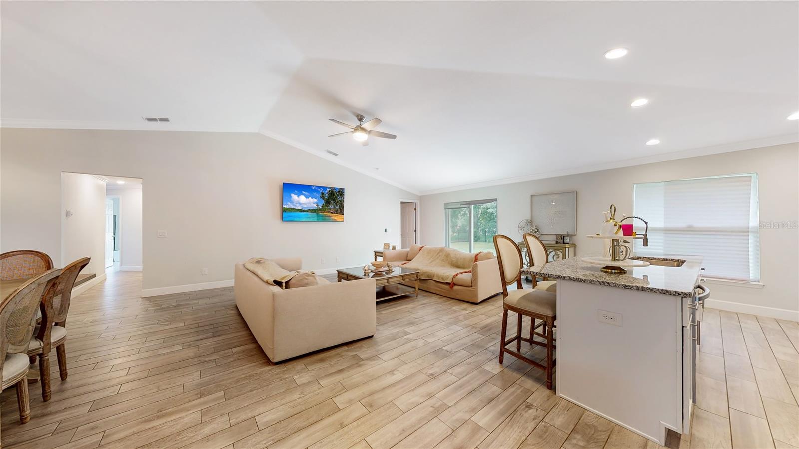 Split plan master bedroom on the far right. The secondary bedrooms on the left